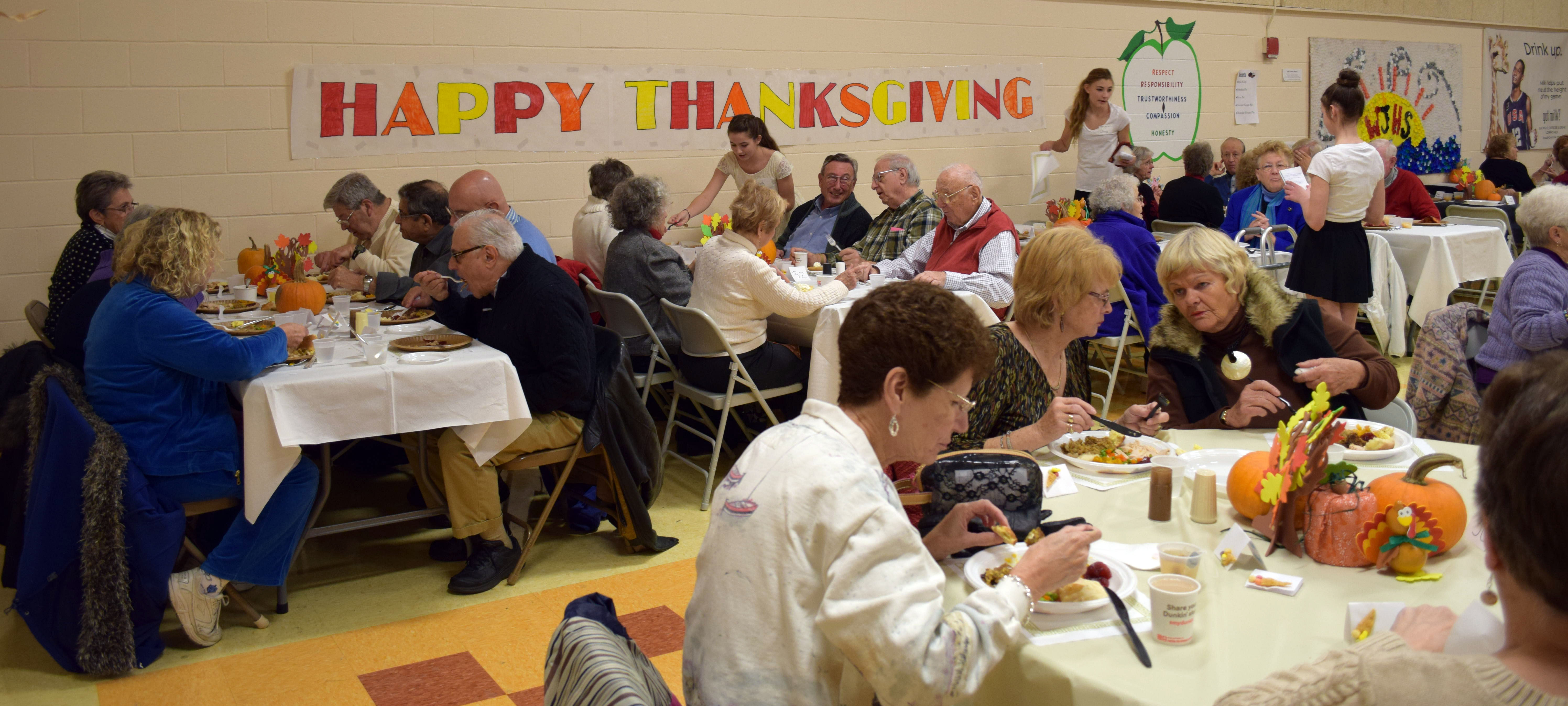 A scene from the 20th Annual Thanksgiving Dinner in 2014 at Wells Junior High School. This annual popular event began in 1994.